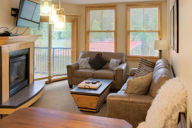 Living room with sofa, loveseat and gas fireplace