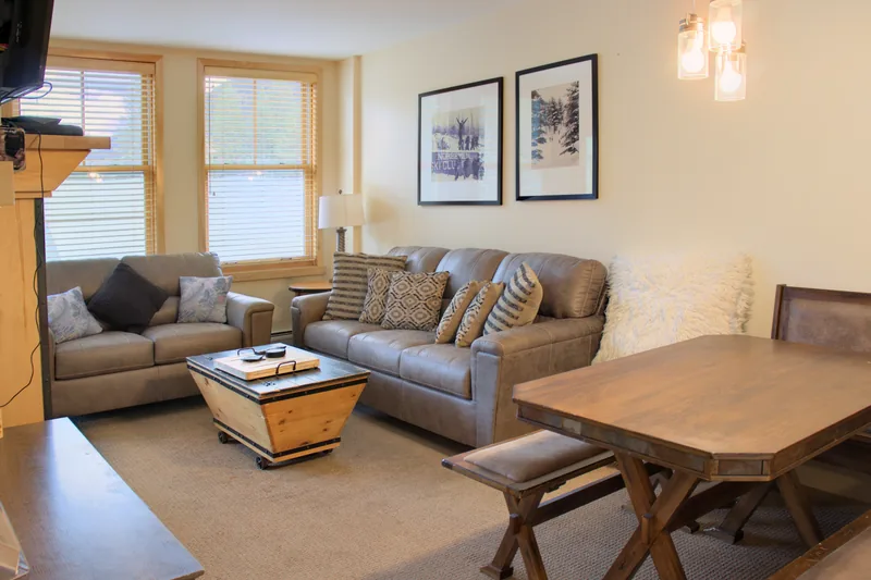 Living and dining area with sofa and loveseat
