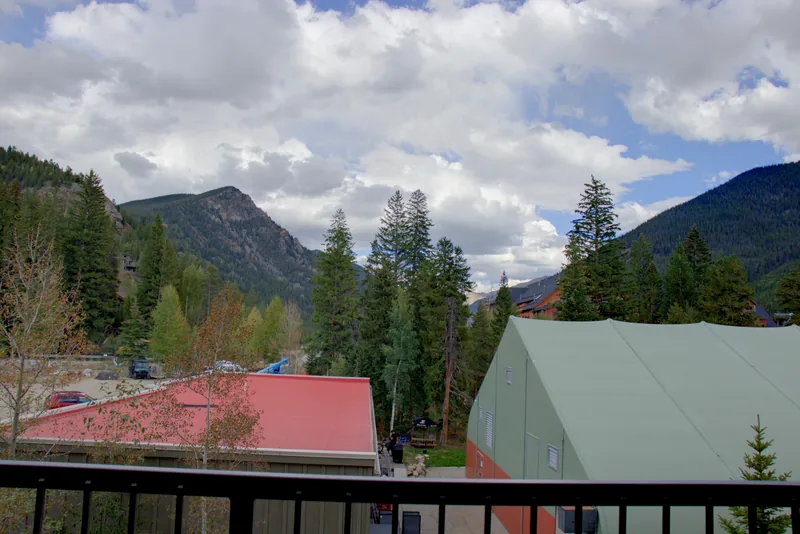 Mountain view from the balcony, with neighboring village buildings